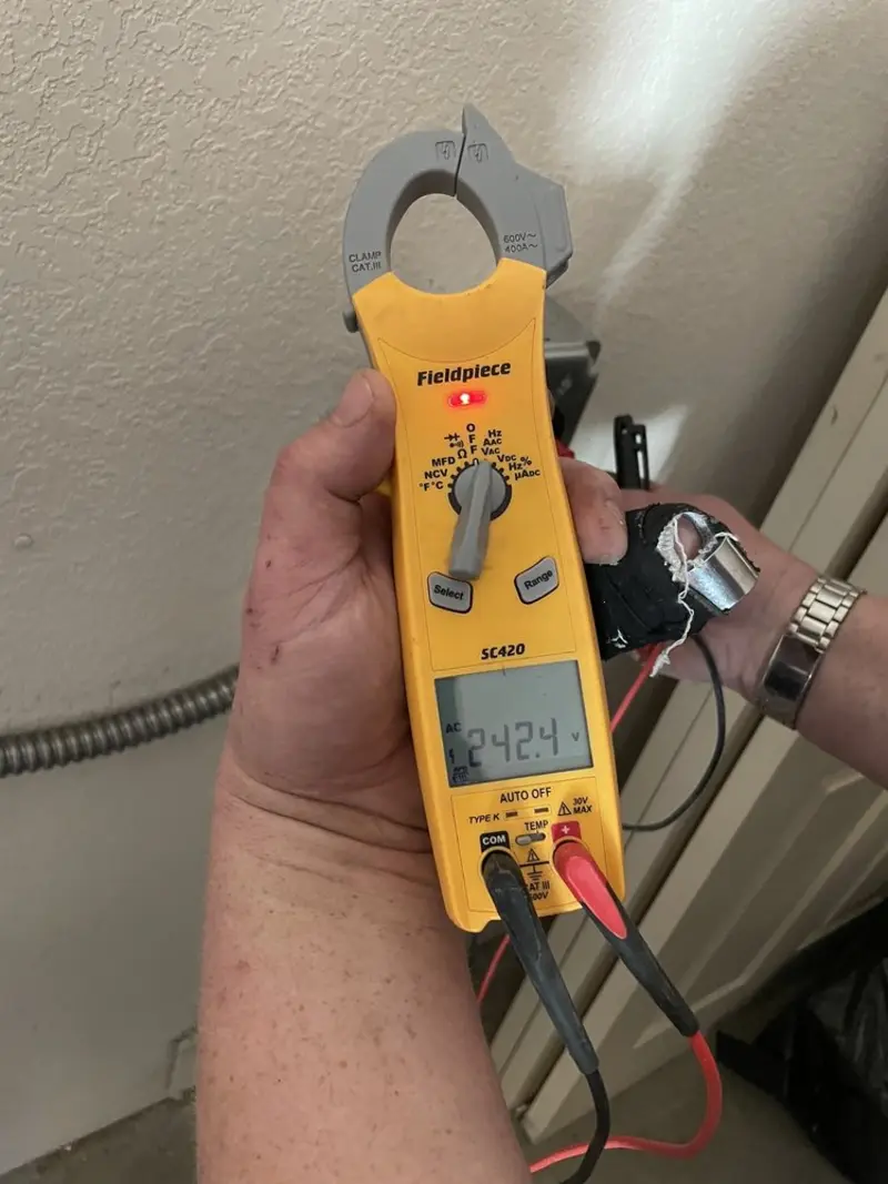 Voltage testing with clamp meter during Whole House Surge Protector in Guntersville